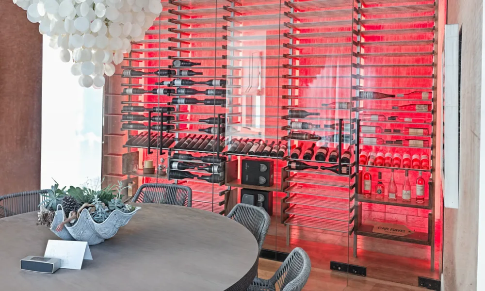 A glass wine cellar should coordinate enclosure, lighting, access, racks and storage conditions so the collection can remain visible without becoming only a display feature.