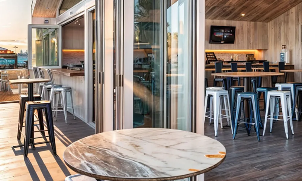 The position of open door panels can affect table spacing and the route between indoor and outdoor dining