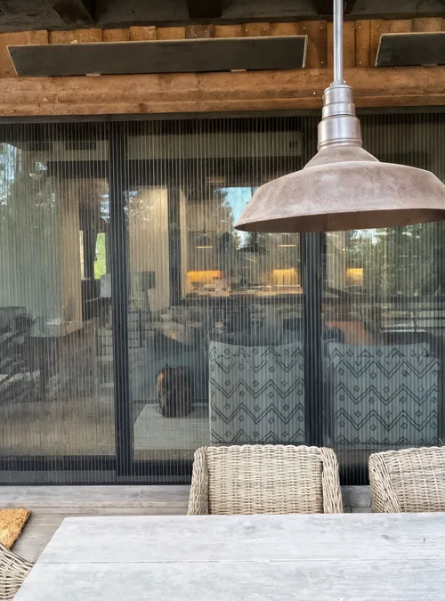 A 90-degree configuration defines a corner condition—not the panel destination. Panels may still stack along either elevation or move into wall pockets.