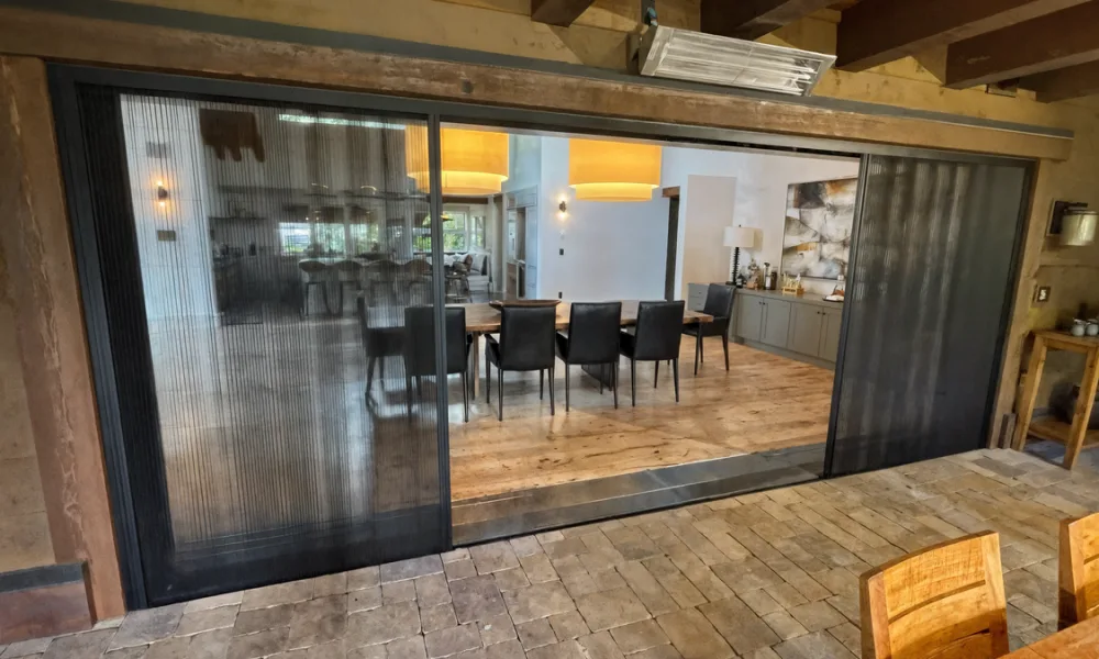 Sliding panels move along parallel tracks or into a wall pocket, while bi-fold doors collect at the side of the opening. Panel movement and storage determine how much usable passage each system provides.